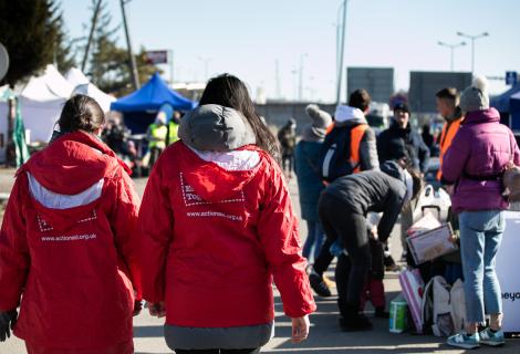 Displaced women and children arrive at Hrebenne, a crossing point on the Polish side of the Ukraine-Poland border where ActionAid and partner PAH are working. 