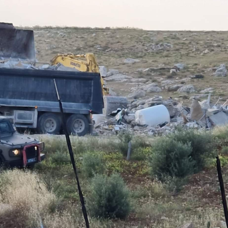 Vehicles demolishing school
